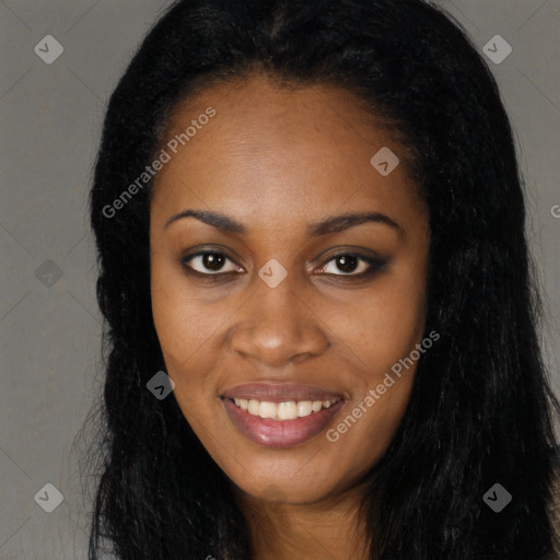 Joyful black young-adult female with long  black hair and brown eyes