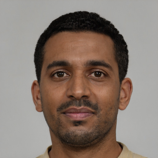 Neutral black young-adult male with short  black hair and brown eyes