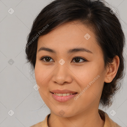 Joyful latino young-adult female with medium  brown hair and brown eyes