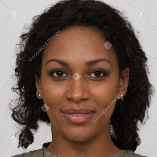 Joyful black young-adult female with medium  brown hair and brown eyes