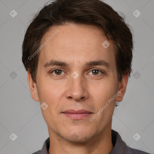 Joyful white adult male with short  brown hair and brown eyes