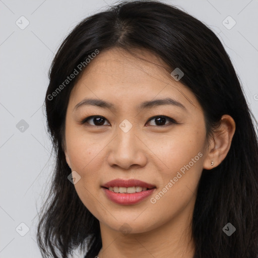 Joyful asian young-adult female with long  brown hair and brown eyes