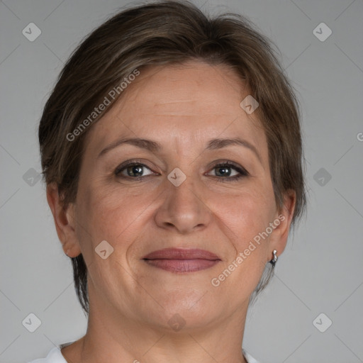 Joyful white adult female with medium  brown hair and brown eyes