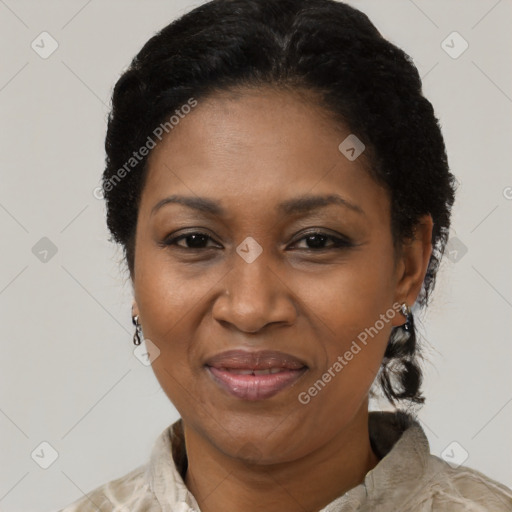 Joyful black adult female with short  black hair and brown eyes