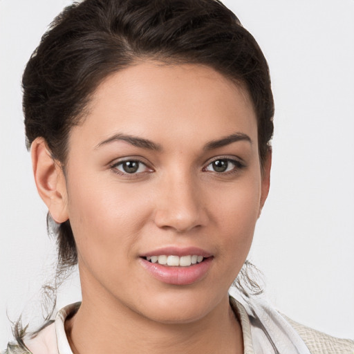 Joyful white young-adult female with medium  brown hair and brown eyes