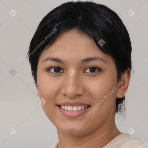 Joyful asian young-adult female with short  black hair and brown eyes