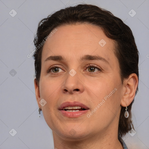 Joyful white adult female with medium  brown hair and brown eyes