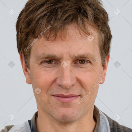 Joyful white adult male with short  brown hair and grey eyes