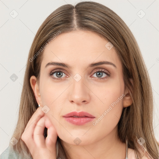 Neutral white young-adult female with long  brown hair and brown eyes