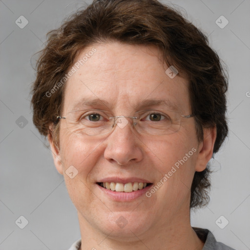 Joyful white adult female with short  brown hair and grey eyes