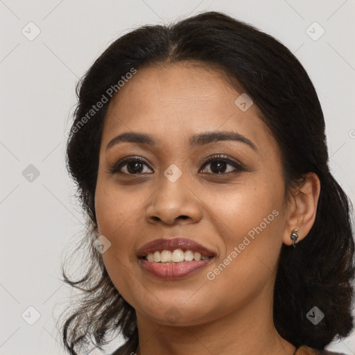 Joyful latino young-adult female with medium  brown hair and brown eyes