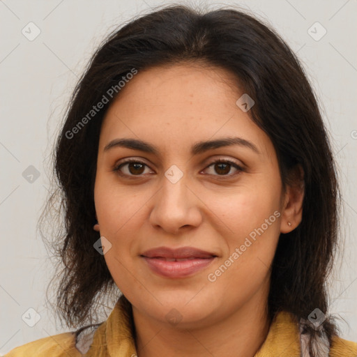 Joyful latino adult female with long  brown hair and brown eyes