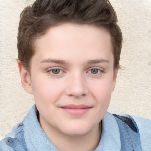 Joyful white child male with short  brown hair and grey eyes