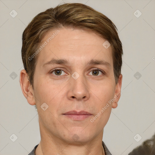 Joyful white adult male with short  brown hair and grey eyes