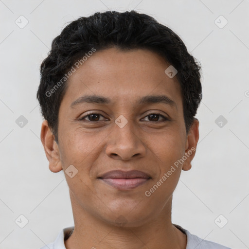 Joyful latino young-adult male with short  brown hair and brown eyes