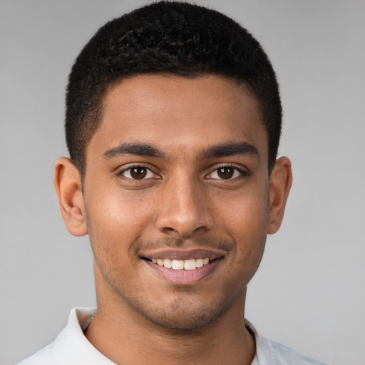 Joyful latino young-adult male with short  brown hair and brown eyes