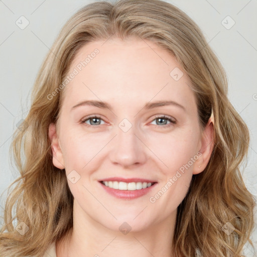 Joyful white young-adult female with long  brown hair and blue eyes