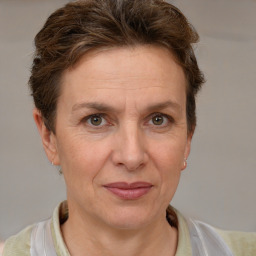 Joyful white adult female with short  brown hair and brown eyes