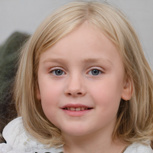 Joyful white child female with medium  brown hair and blue eyes