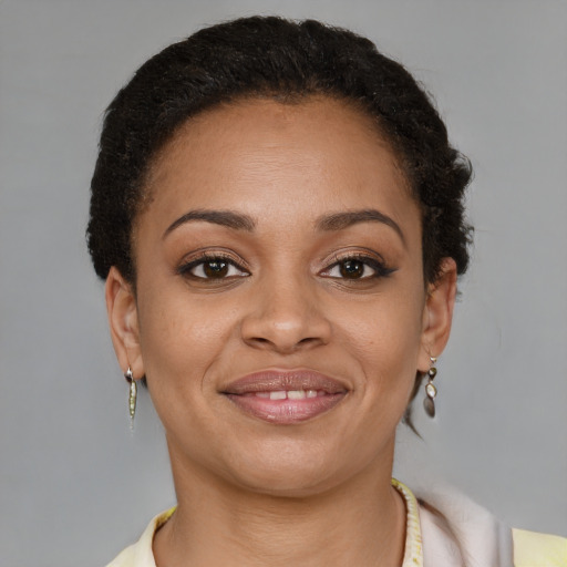 Joyful latino young-adult female with short  brown hair and brown eyes