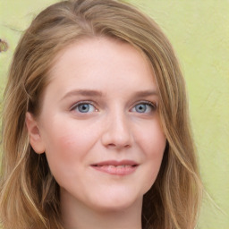 Joyful white young-adult female with long  brown hair and blue eyes