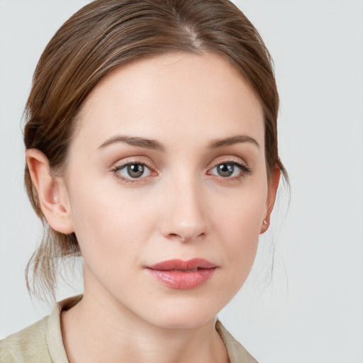 Neutral white young-adult female with medium  brown hair and grey eyes