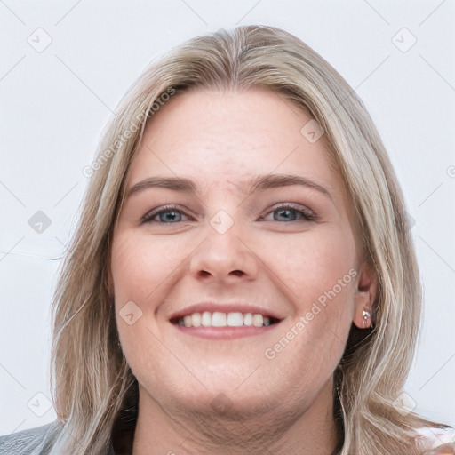 Joyful white young-adult female with long  brown hair and blue eyes