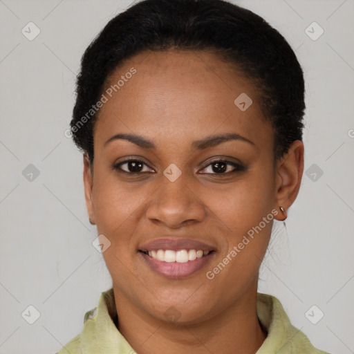 Joyful black young-adult female with short  black hair and brown eyes