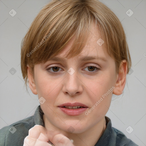 Joyful white young-adult female with medium  brown hair and blue eyes