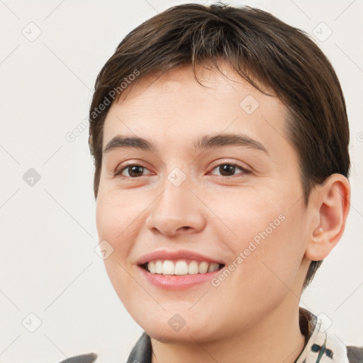 Joyful white young-adult female with short  brown hair and brown eyes