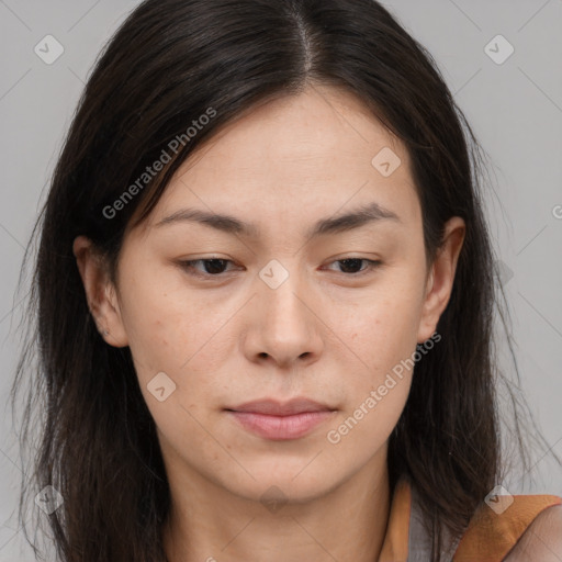 Joyful asian young-adult female with long  brown hair and brown eyes