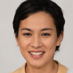 Joyful asian young-adult female with short  brown hair and brown eyes