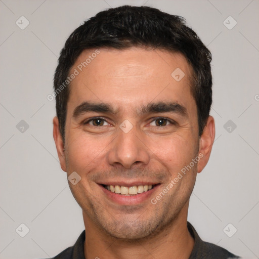 Joyful white young-adult male with short  black hair and brown eyes