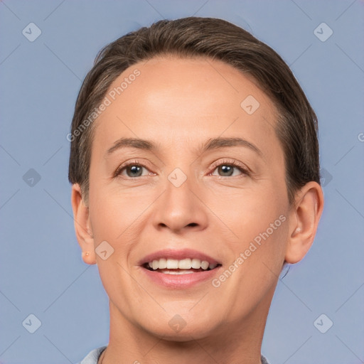 Joyful white adult female with short  brown hair and brown eyes