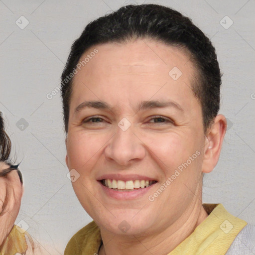 Joyful white adult female with short  brown hair and brown eyes