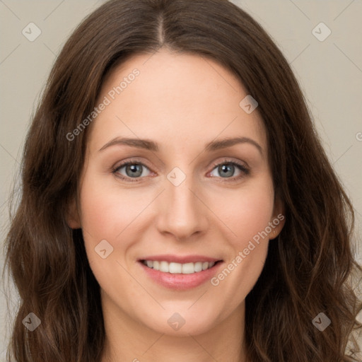 Joyful white young-adult female with long  brown hair and green eyes