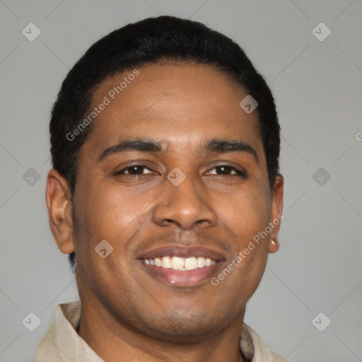 Joyful latino young-adult male with short  brown hair and brown eyes