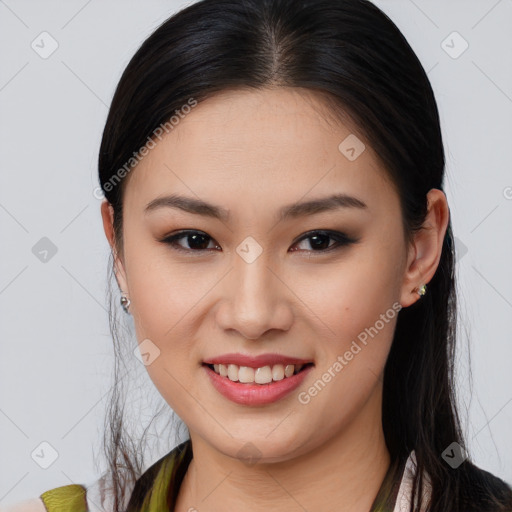 Joyful asian young-adult female with long  brown hair and brown eyes