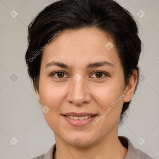 Joyful white adult female with medium  brown hair and brown eyes