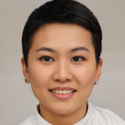 Joyful asian young-adult female with short  black hair and brown eyes