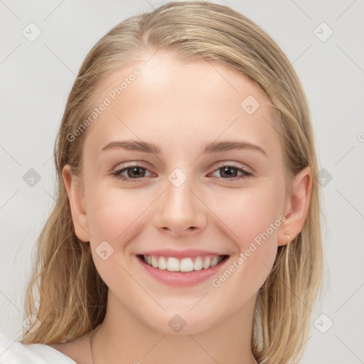 Joyful white child female with medium  brown hair and brown eyes