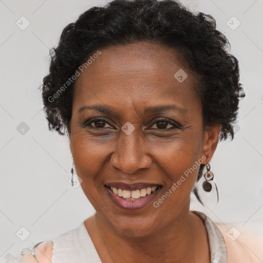 Joyful black adult female with short  brown hair and brown eyes