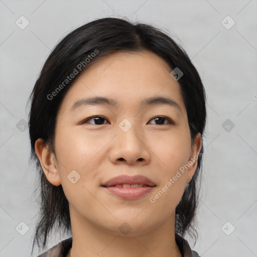 Joyful asian young-adult female with medium  black hair and brown eyes