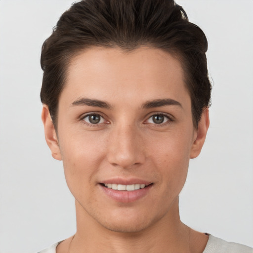 Joyful white young-adult female with short  brown hair and brown eyes