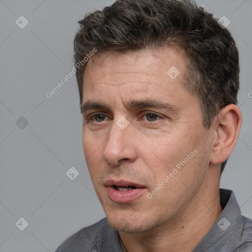 Neutral white adult male with short  brown hair and brown eyes