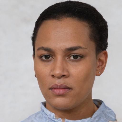 Neutral latino young-adult female with short  black hair and brown eyes