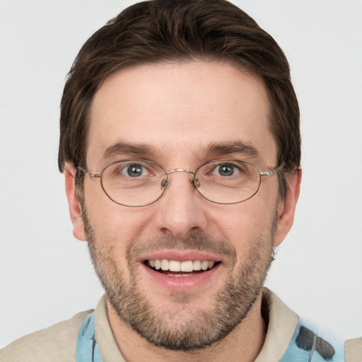 Joyful white adult male with short  brown hair and grey eyes