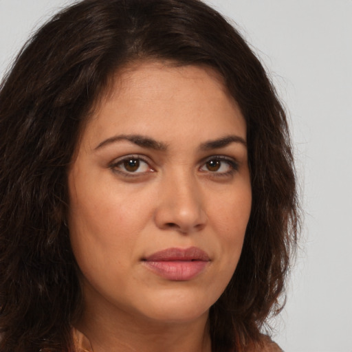 Joyful white young-adult female with long  brown hair and brown eyes
