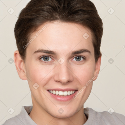 Joyful white young-adult female with short  brown hair and grey eyes