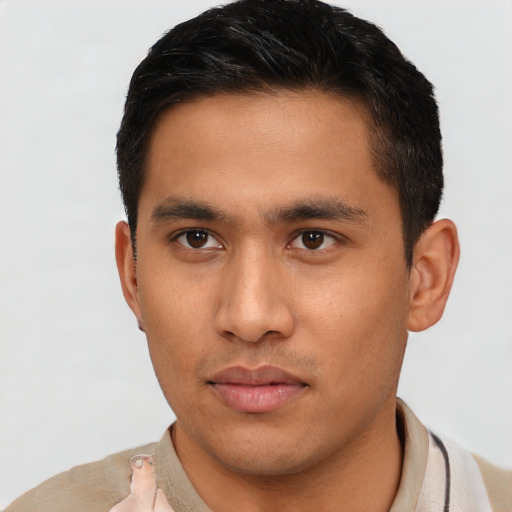 Neutral latino young-adult male with short  brown hair and brown eyes